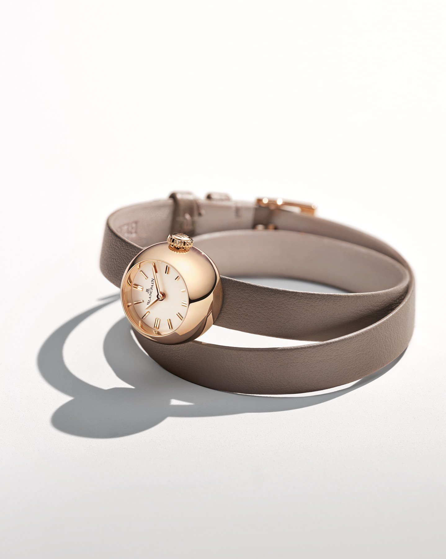 A Blancpain Lady B on a taupe double-tour leather strap, photographed against white