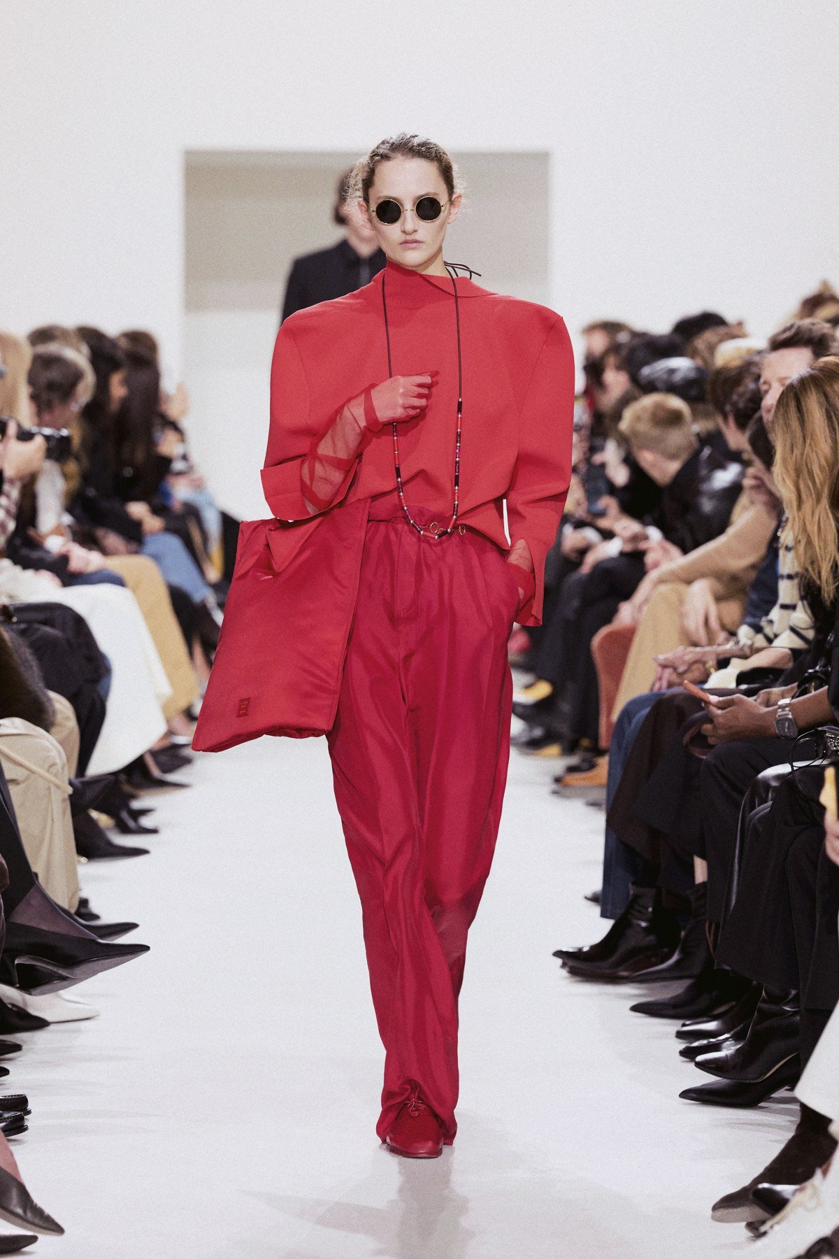 CELINE Été 2027: a red layered look on the runway