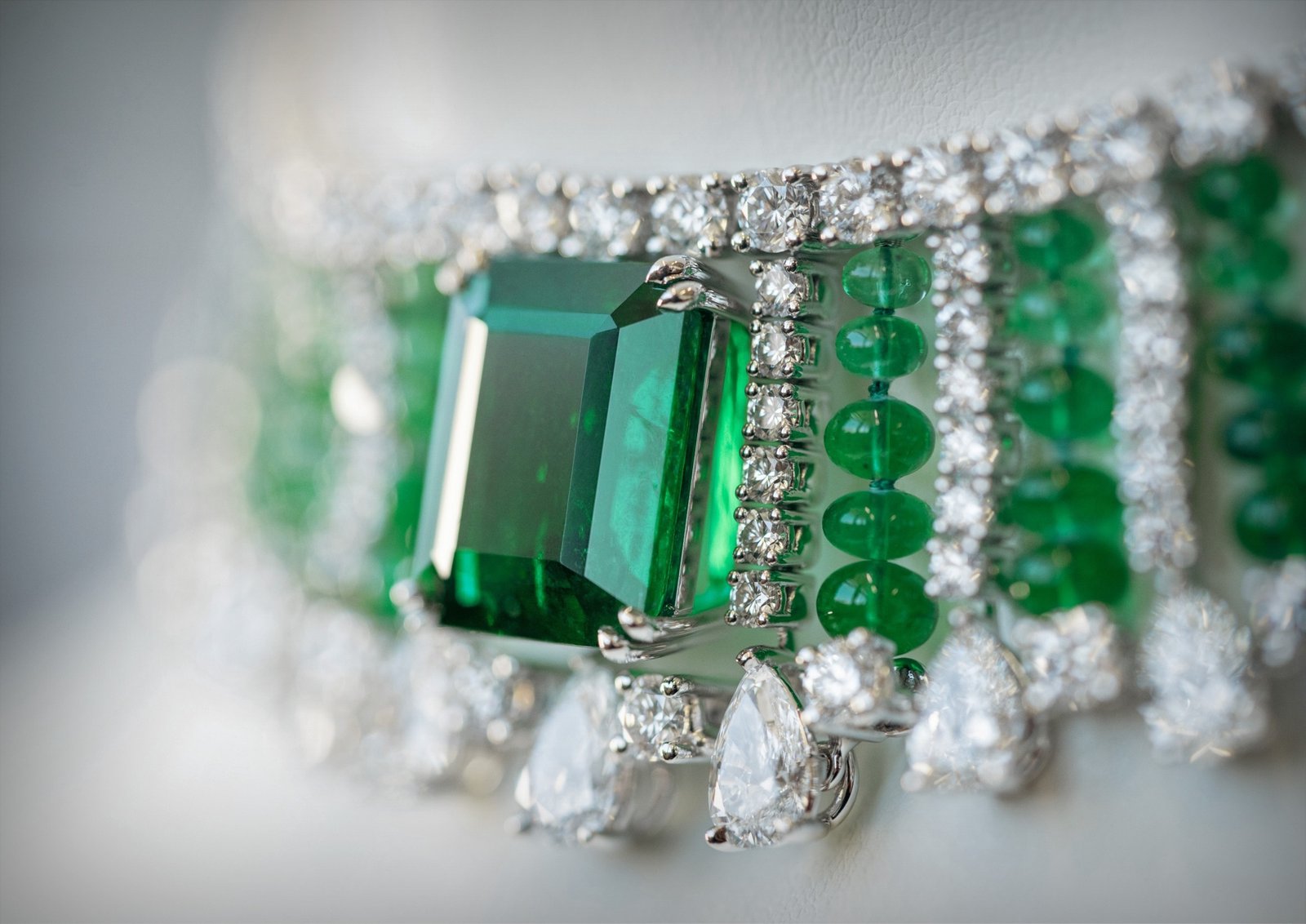 Close-up of green and colourless gemstone jewellery from Chopard’s Miracles collection