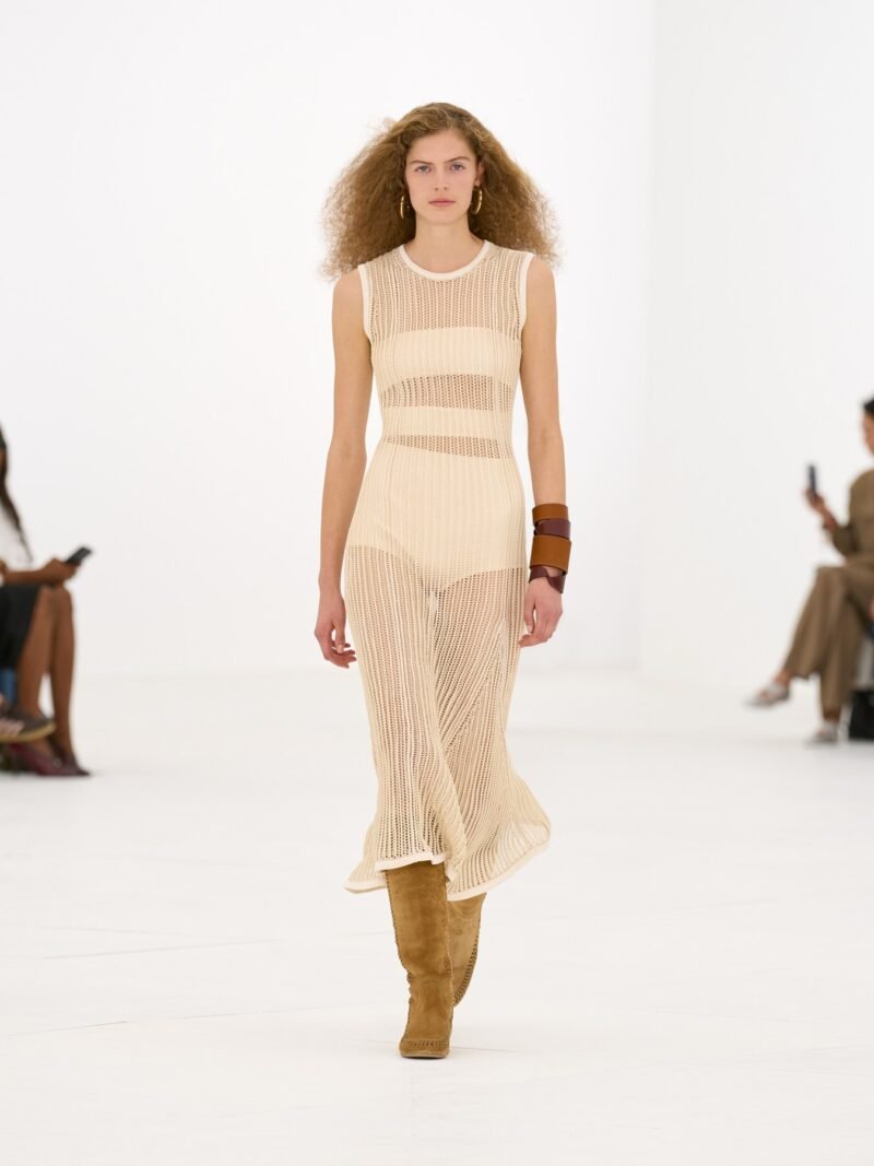 Hermès SS27 runway look with light open-knit dress and boots