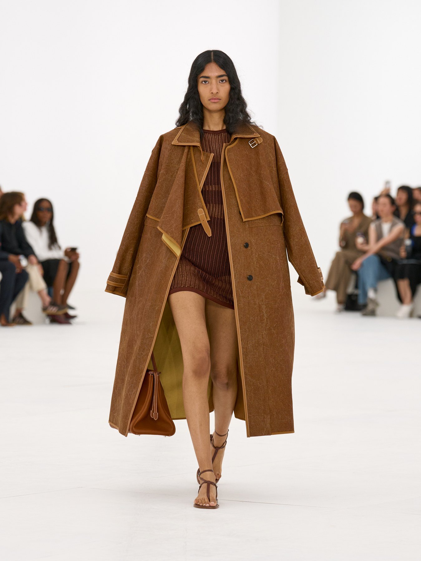 Hermès SS27 runway look with brown coat and tonal dress