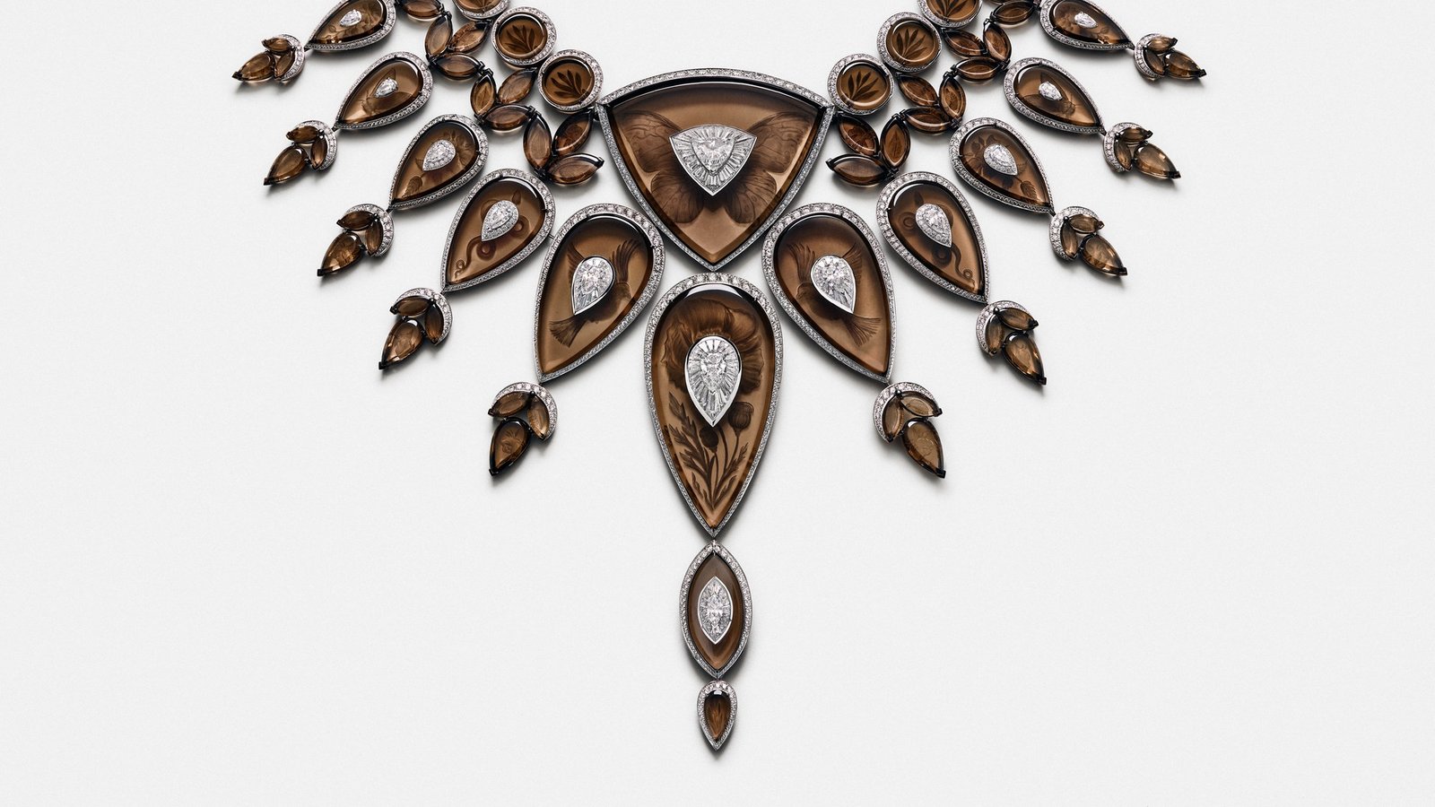 Tattoo necklace in smoky quartz, diamonds and white gold, with motifs engraved on the reverse of the stones.