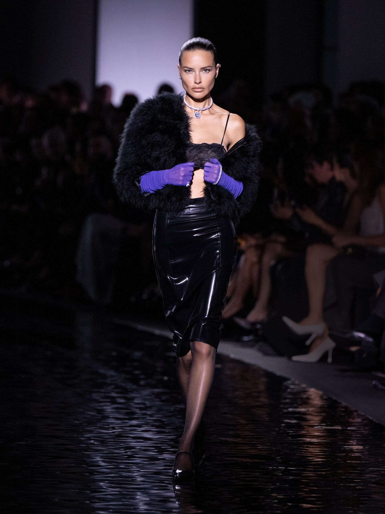 Adriana Lima on Messika’s runway wearing Divine Enigma jewellery, a black wrap and purple gloves