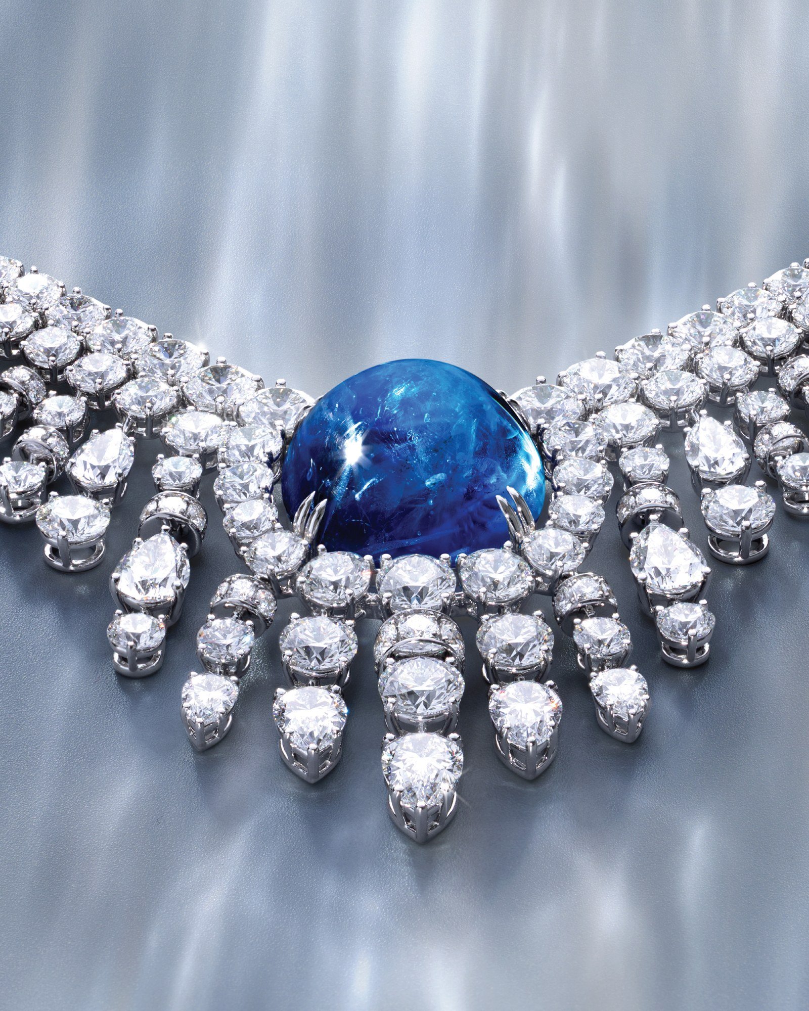 Low-angle detail of the Sri Lankan sapphire and diamond drops in Mouawad’s Cascading Veil necklace