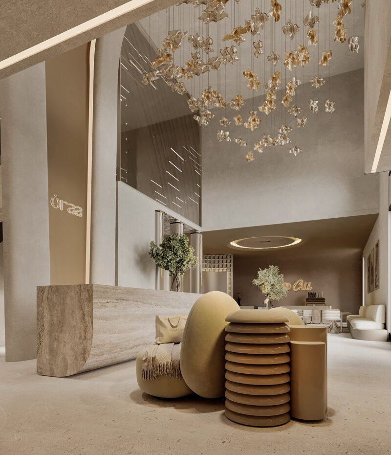 3D rendering of ORAA’s reception with a tall arch, sculptural cream seating, a pale counter and suspended gold-toned forms