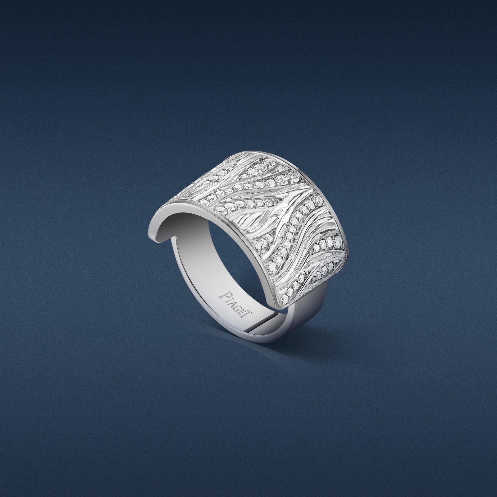 Piaget Glow white-gold ring with undulating curves and 70 diamonds totalling 0.45 carats.