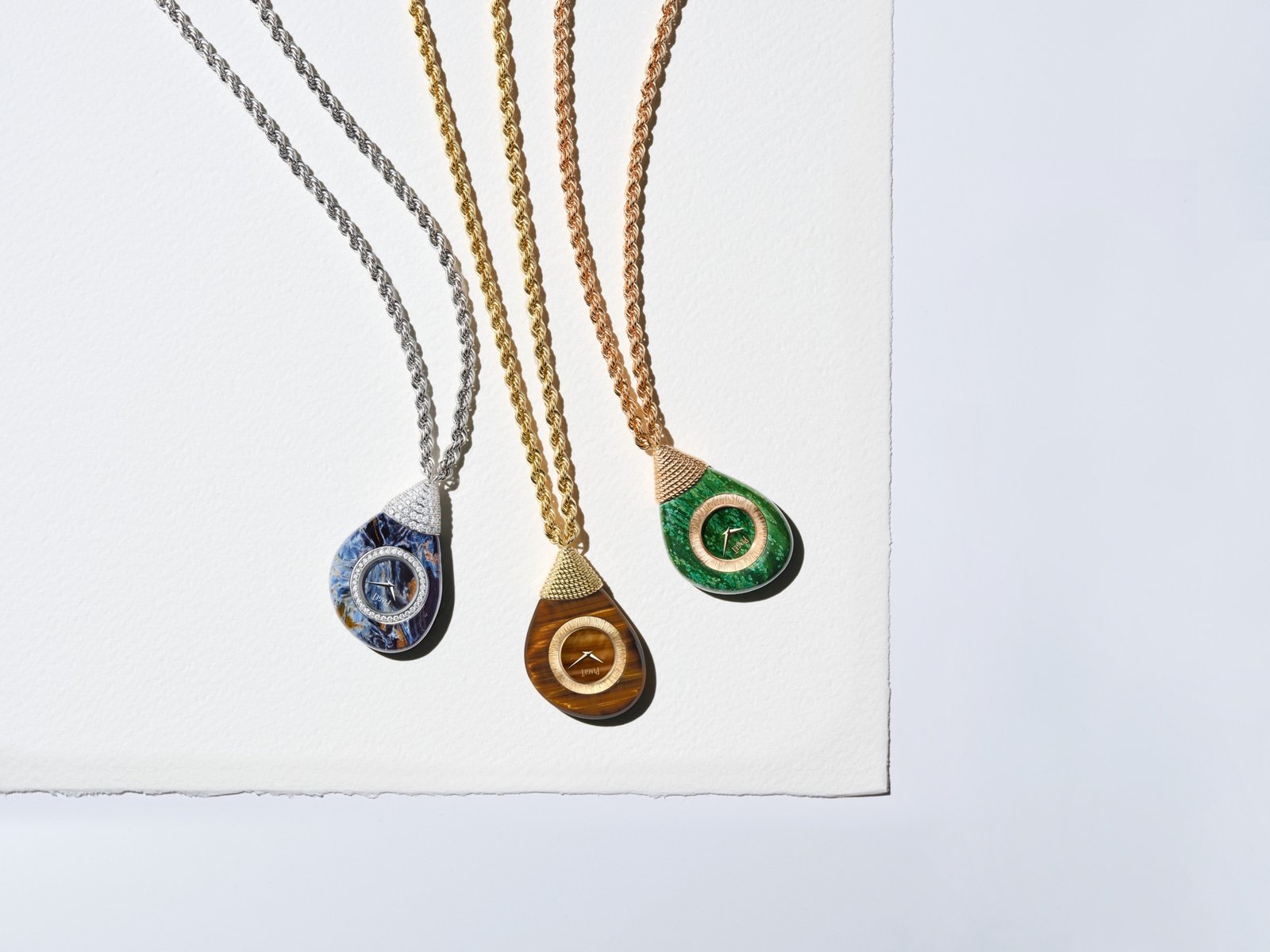 The three Swinging Pebbles watches: pietersite with white gold, tiger’s eye with yellow gold, and verdite with rose gold.