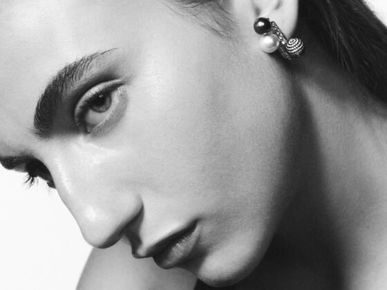 Repossi Sphere Earring with grey pearls and a diamond-pavéd sphere worn close to the ear