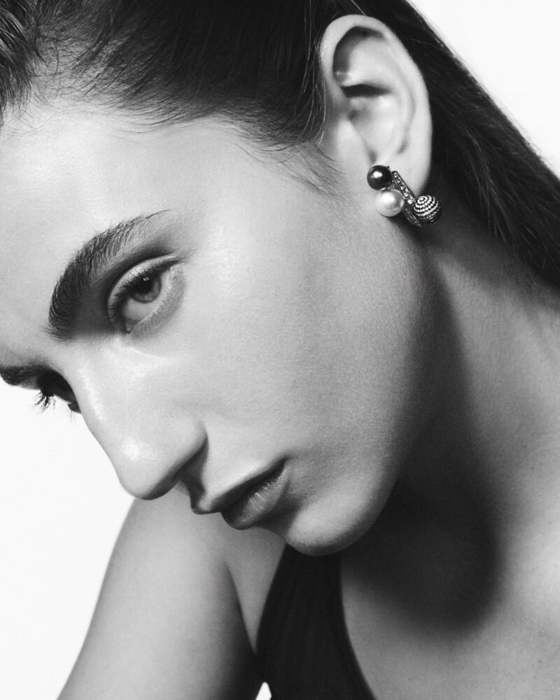 Repossi Sphere Earring with grey pearls and a diamond-pavéd sphere worn close to the ear