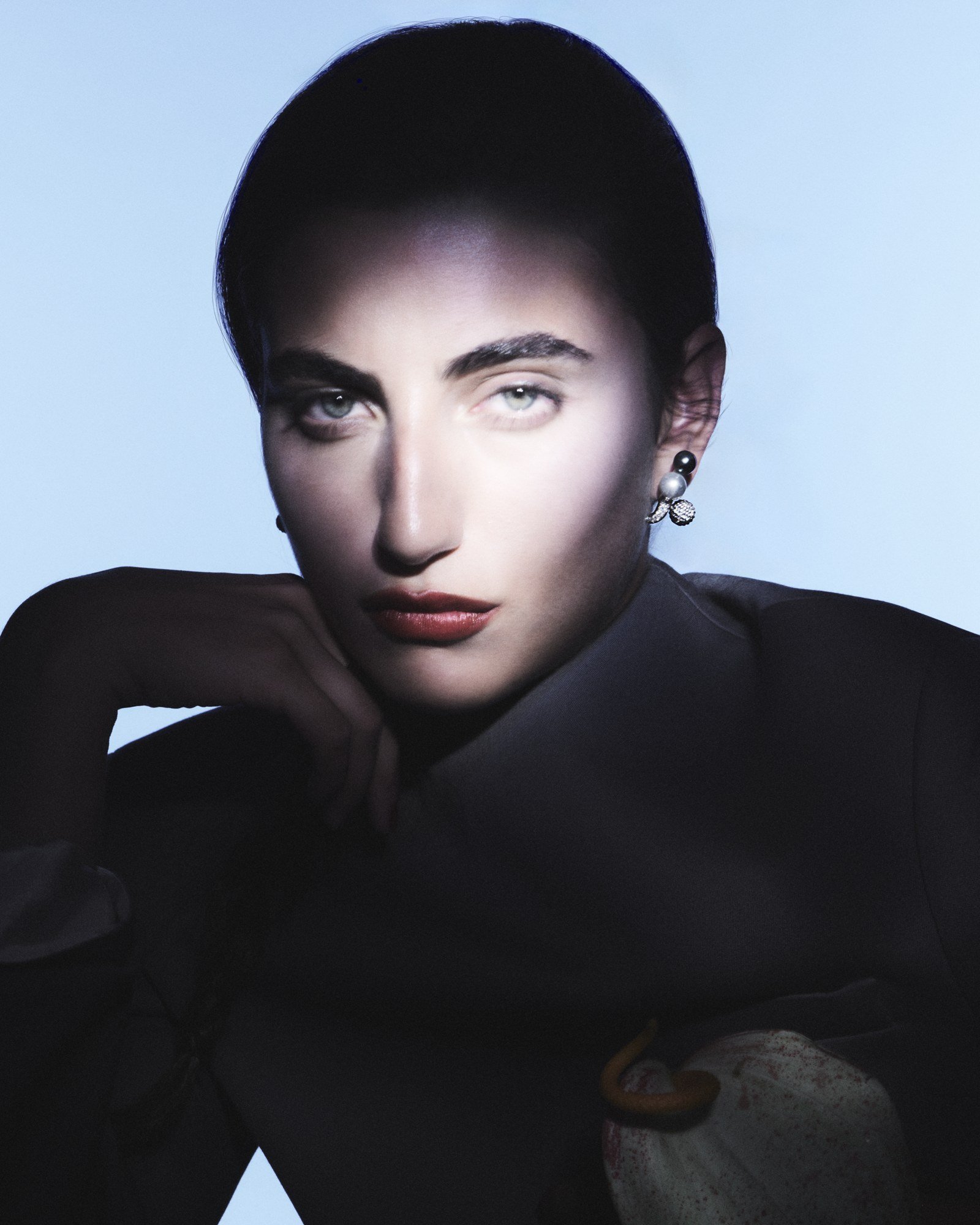 Repossi Sphere Earring in a colour campaign portrait against a pale blue background