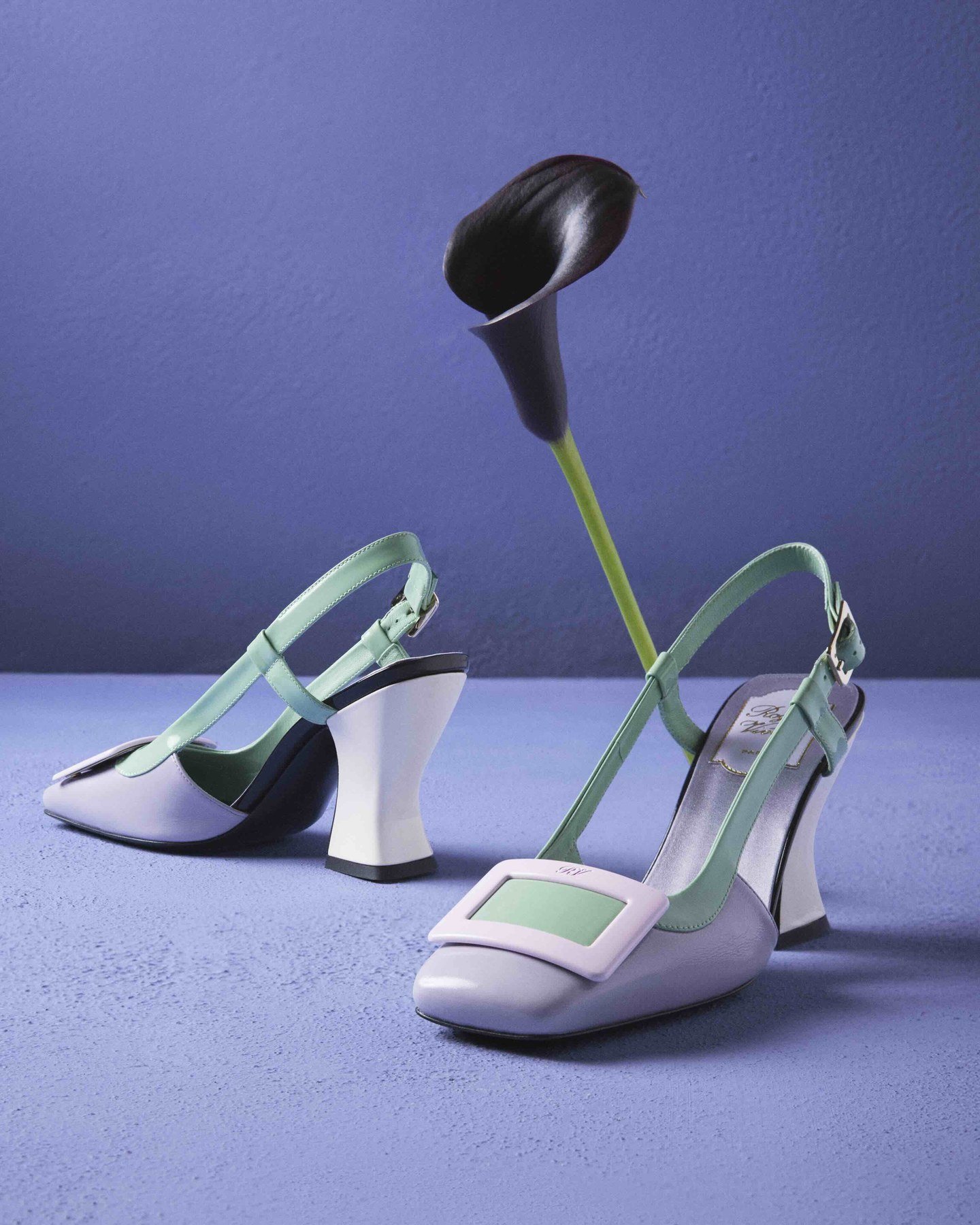 Lavender and green Roger Vivier slingbacks against a violet backdrop