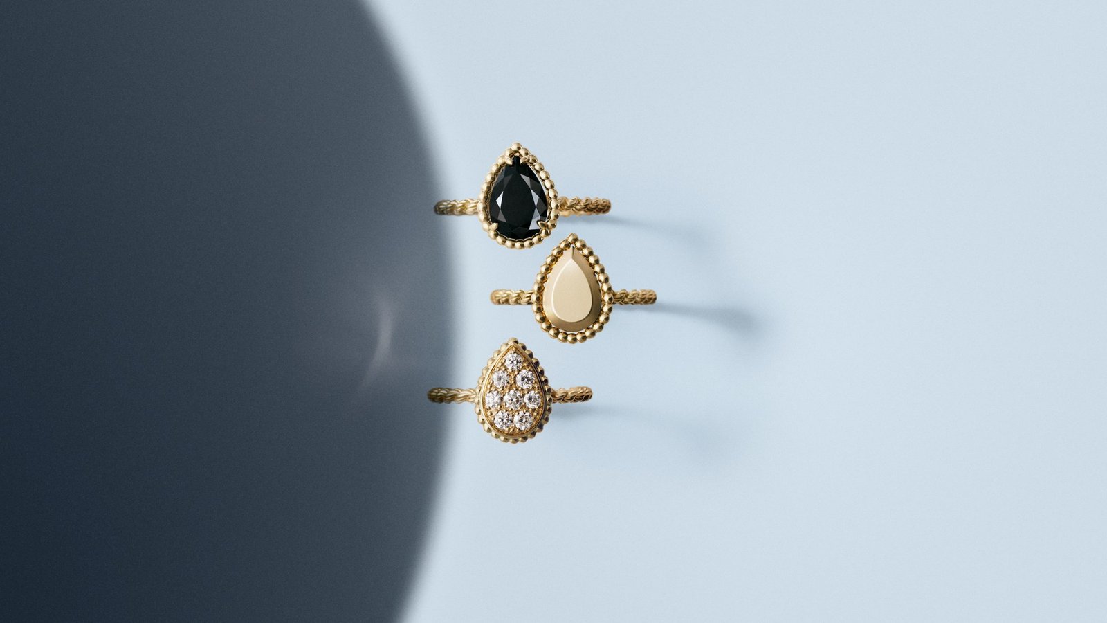 Serpent Bohème rings illustrate the collection’s onyx, polished-gold and diamond-set expressions. The diamond-set ring is shown for styling context, not identified as one of the twelve new designs.