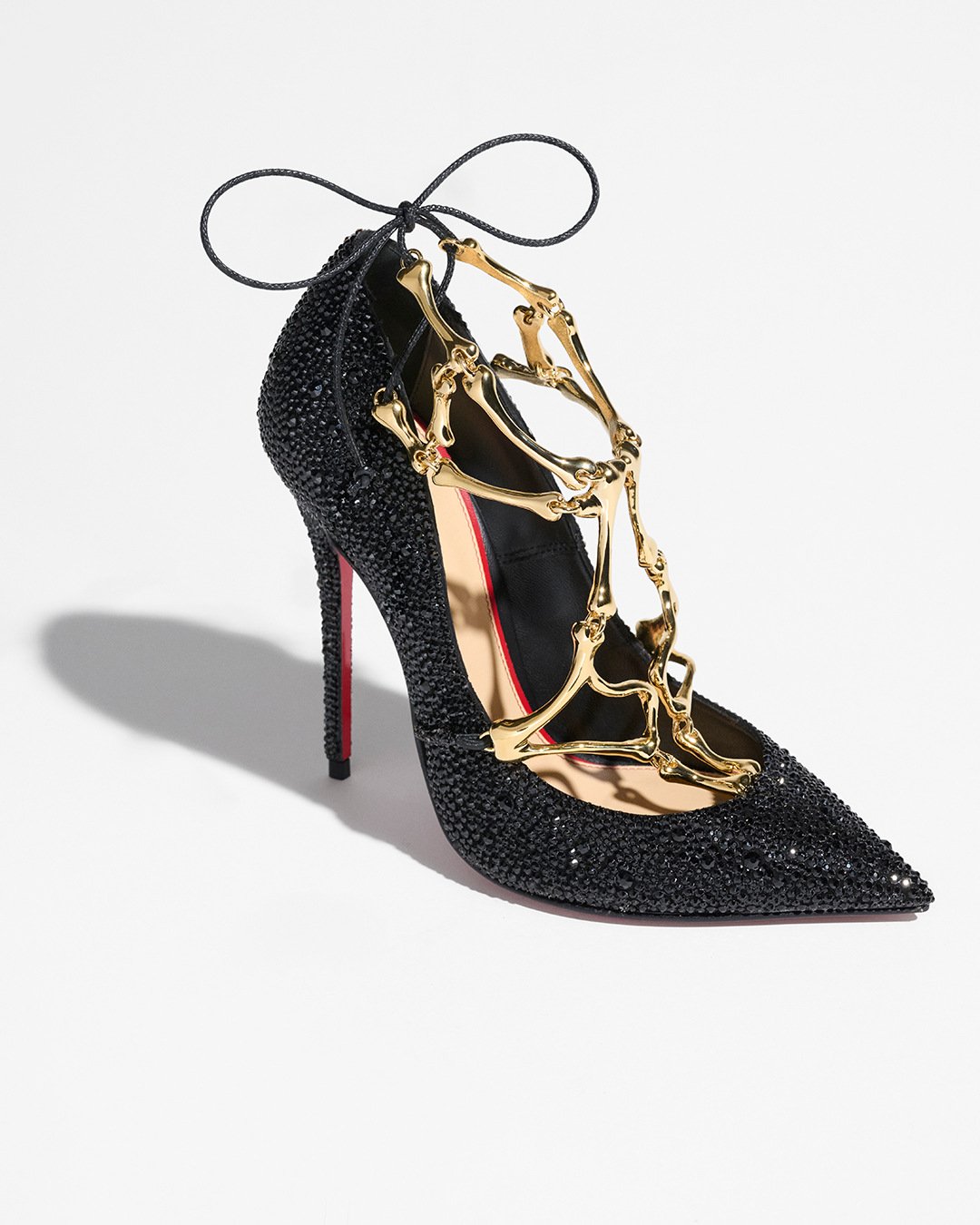 Black Macbetha pump with crystal embellishment and sculptural gold-tone metalwork