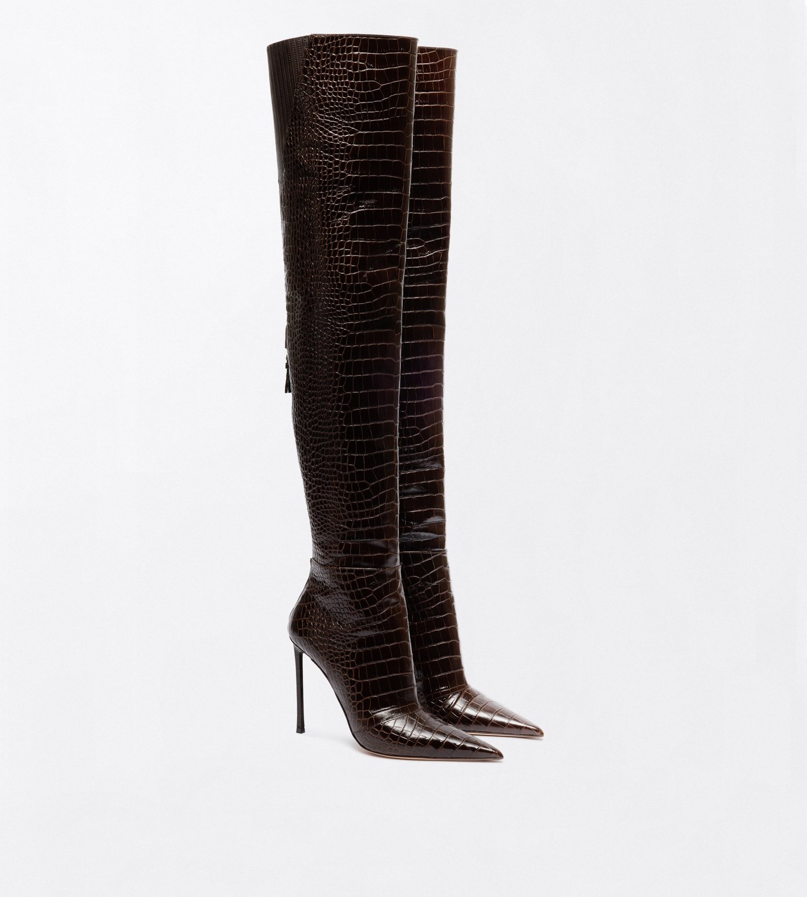 A pair of dark-brown textured Tom Ford tall boots with pointed toes and thin high heels