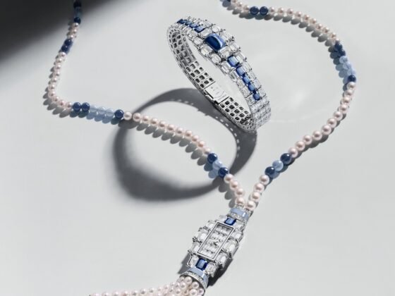 Sapphire-set Grand Lady Kalla bracelet arranged inside its pearl sautoir with a pendant watch and tassel