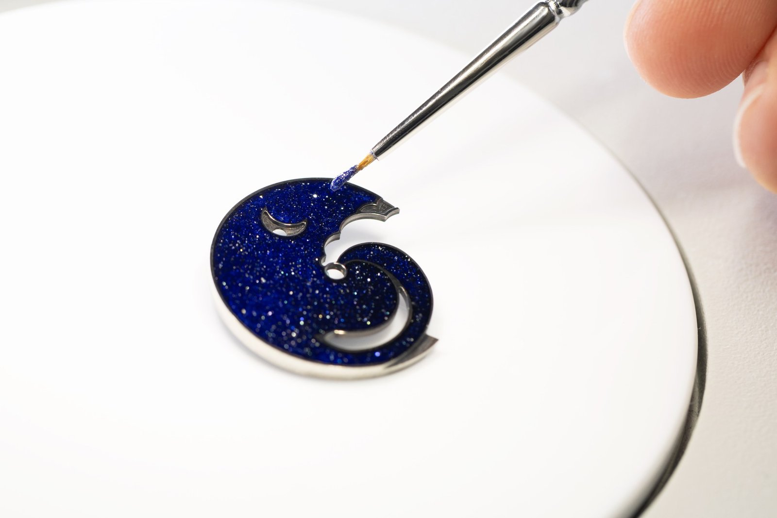 Applying glitter-gradient champlevé enamel to the Lady Rencontre Céleste dial base