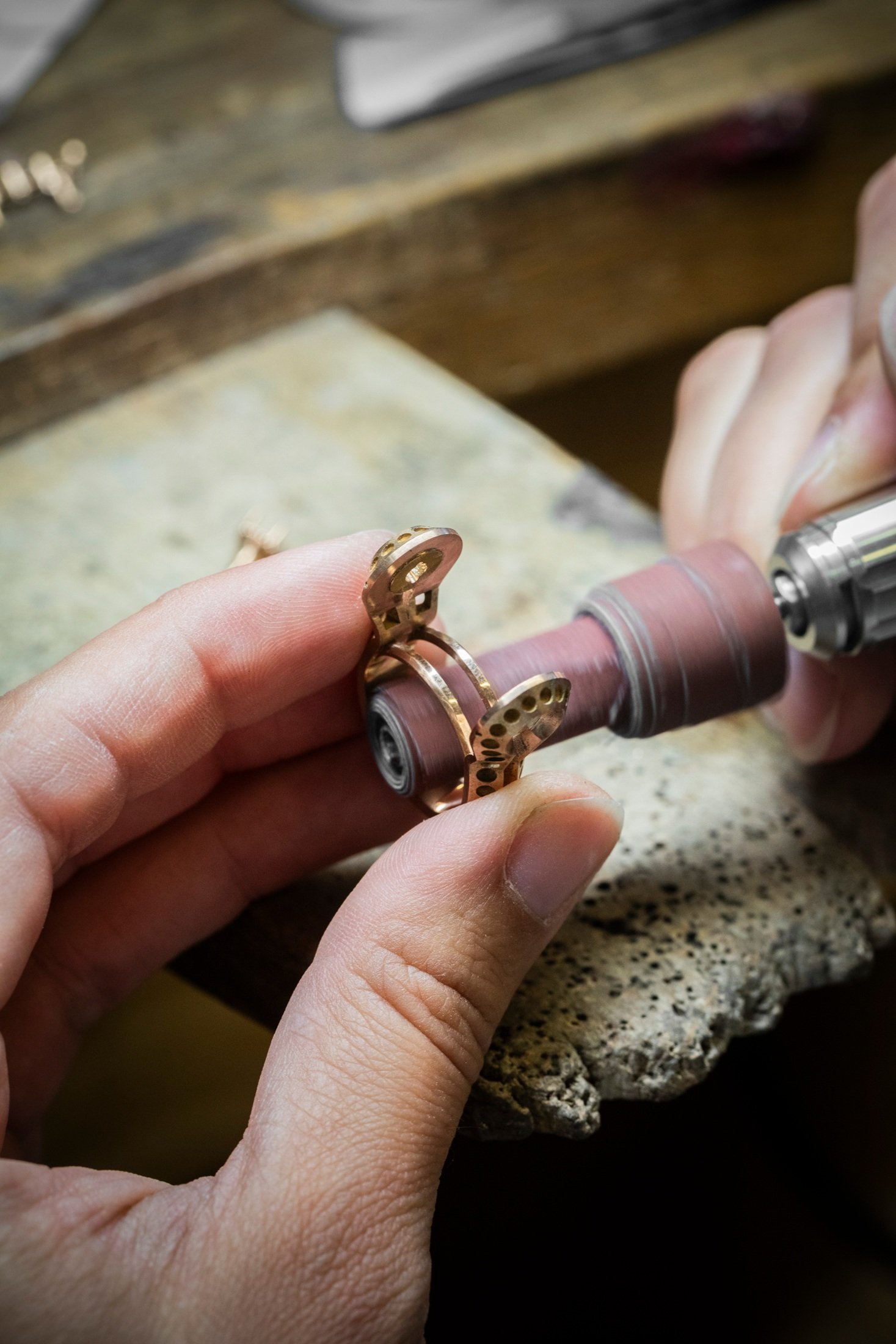 Polishing a sculptural gold ring in the Van Cleef & Arpels workshop